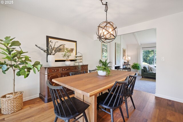 1437 Greentree Cir, Lake Oswego, OR 97034 - dining area with baseboards, wood finished floors, and a chandelier