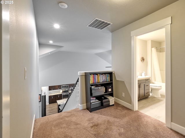 office area with visible vents, baseboards, lofted ceiling, carpet floors, and recessed lighting