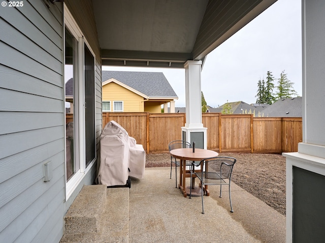 view of patio featuring a fenced backyard and outdoor dining space