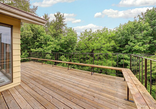 split foyer home with aphalt driveway, a shingled roof, a chimney, and a garage