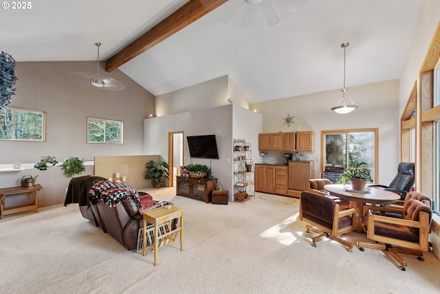 carpeted living room featuring ceiling fan, beam ceiling, high vaulted ceiling, and a wealth of natural light