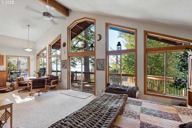 carpeted bedroom featuring beam ceiling, access to outside, and high vaulted ceiling