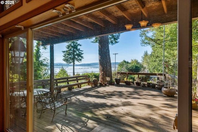 wooden deck with a water view