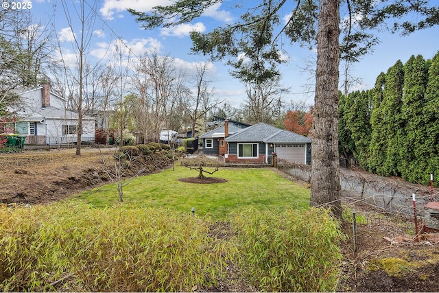 view of yard with an attached garage