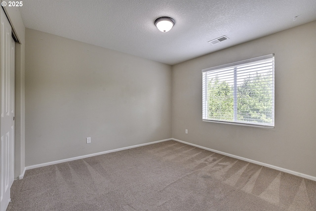 20074 SW Squire Dr, Beaverton, OR 97007 - carpeted spare room featuring baseboards and a textured ceiling