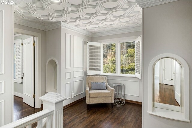 stairs with arched walkways, ornamental molding, and marble finish floor