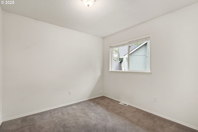 11069 SW Eschman Way, Tigard, OR 97223 - carpeted spare room with baseboards and a textured ceiling