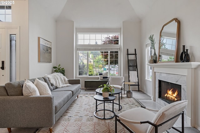 11069 SW Eschman Way, Tigard, OR 97223 - living area featuring healthy amount of natural light, a high end fireplace, and high vaulted ceiling