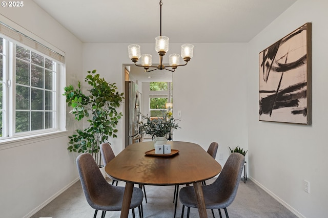 11069 SW Eschman Way, Tigard, OR 97223 - dining room featuring light carpet, a chandelier, and baseboards