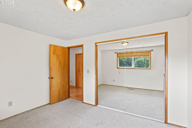 2335 5th St, Columbia City, OR 97018 - unfurnished room featuring carpet floors and a textured ceiling