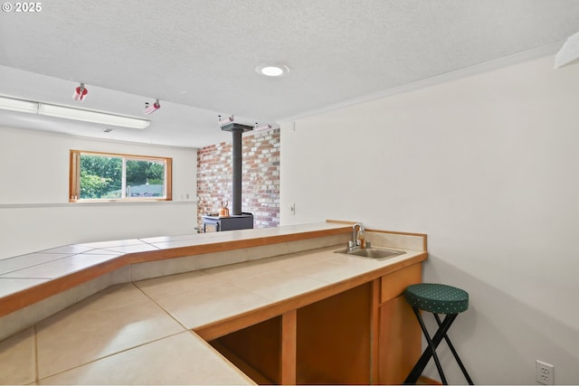 2335 5th St, Columbia City, OR 97018 - indoor wet bar with a wood stove and a textured ceiling
