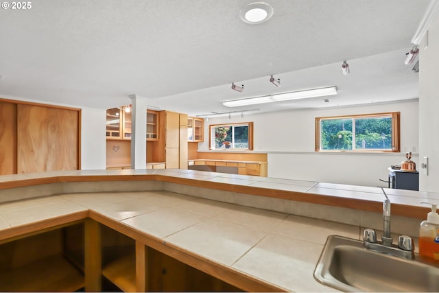 2335 5th St, Columbia City, OR 97018 - kitchen with tile counters and open shelves