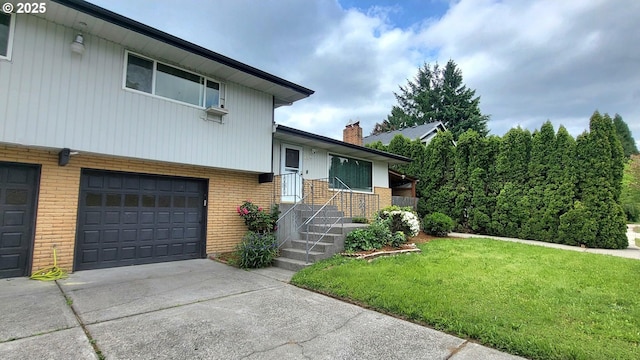 437 SE 154th Ave, Portland, OR 97233 - tri-level home with brick siding, an attached garage, a front yard, concrete driveway, and a chimney