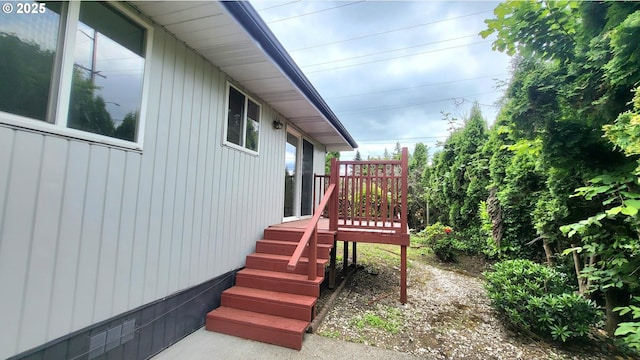 437 SE 154th Ave, Portland, OR 97233 - view of property exterior featuring a deck and board and batten siding
