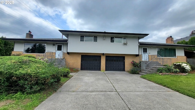 437 SE 154th Ave, Portland, OR 97233 - split level home with brick siding, a chimney, and an attached garage