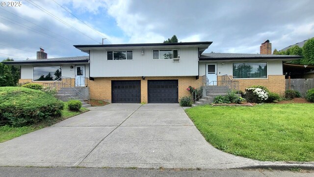 437 SE 154th Ave, Portland, OR 97233 - tri-level home featuring brick siding, a chimney, and an attached garage