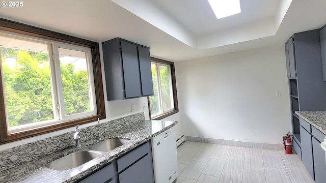 437 SE 154th Ave, Portland, OR 97233 - kitchen with a sink, dishwasher, a tray ceiling, baseboards, and gray cabinetry