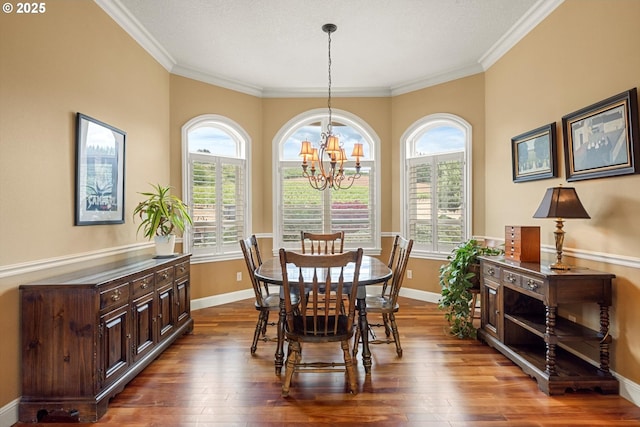 14040 NW Parson Rd, Forest Grove, OR 97116 - dining space with a chandelier, dark wood-type flooring, plenty of natural light, and ornamental molding