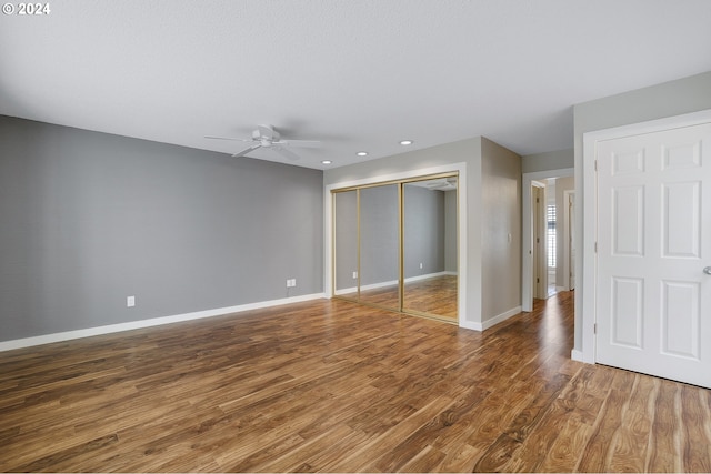 8070 SW Fairway Dr, Wilsonville, OR 97070 - unfurnished bedroom with wood finished floors, baseboards, a closet, recessed lighting, and a ceiling fan