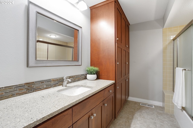 8070 SW Fairway Dr, Wilsonville, OR 97070 - full bathroom with vanity, backsplash, washtub / shower combination, and tile patterned flooring