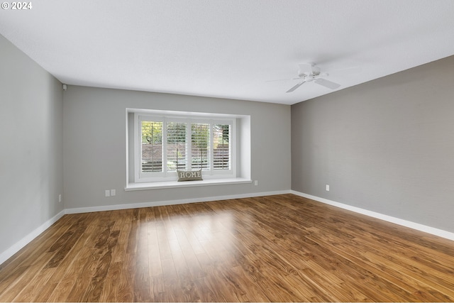 8070 SW Fairway Dr, Wilsonville, OR 97070 - empty room with a ceiling fan and wood finished floors