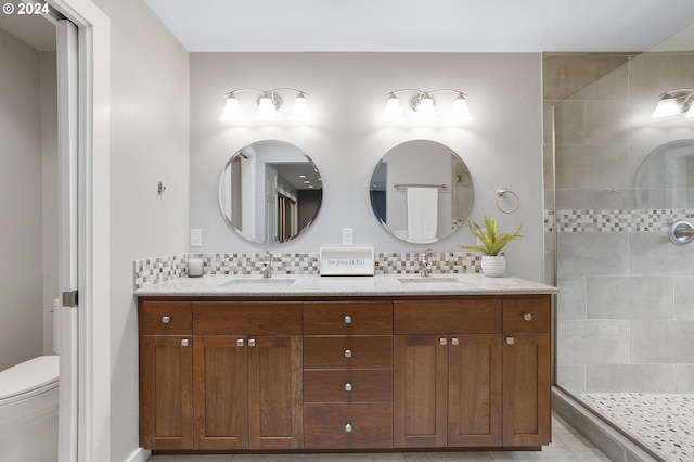 8070 SW Fairway Dr, Wilsonville, OR 97070 - full bath featuring double vanity, toilet, tasteful backsplash, and a tile shower