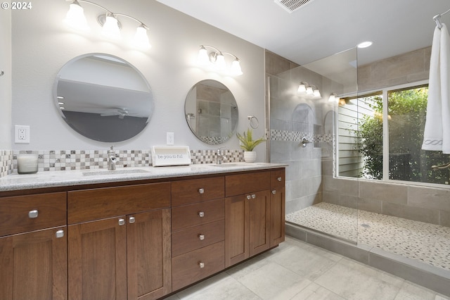 8070 SW Fairway Dr, Wilsonville, OR 97070 - full bathroom with double vanity, backsplash, a walk in shower, and tile patterned flooring