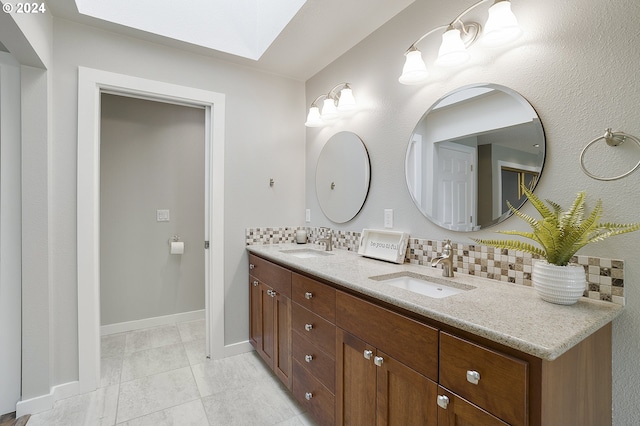 8070 SW Fairway Dr, Wilsonville, OR 97070 - bathroom featuring double vanity, tasteful backsplash, and baseboards