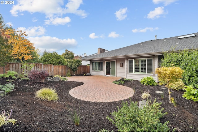 8070 SW Fairway Dr, Wilsonville, OR 97070 - back of house with a patio and a chimney