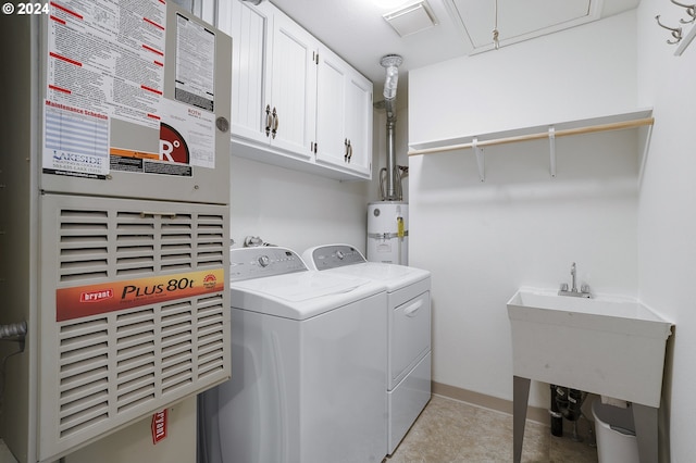8070 SW Fairway Dr, Wilsonville, OR 97070 - laundry area with cabinet space, washing machine and dryer, electric water heater, attic access, and heating unit