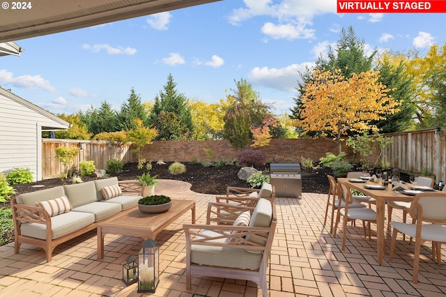 8070 SW Fairway Dr, Wilsonville, OR 97070 - fenced backyard with outdoor lounge area, a patio area, outdoor dining space, and area for grilling