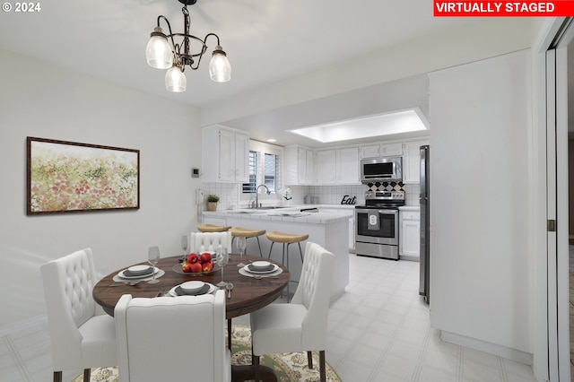 8070 SW Fairway Dr, Wilsonville, OR 97070 - dining space featuring a chandelier and light floors