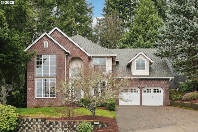 view of front facade with concrete driveway, brick siding, a garage, and a shingled roof