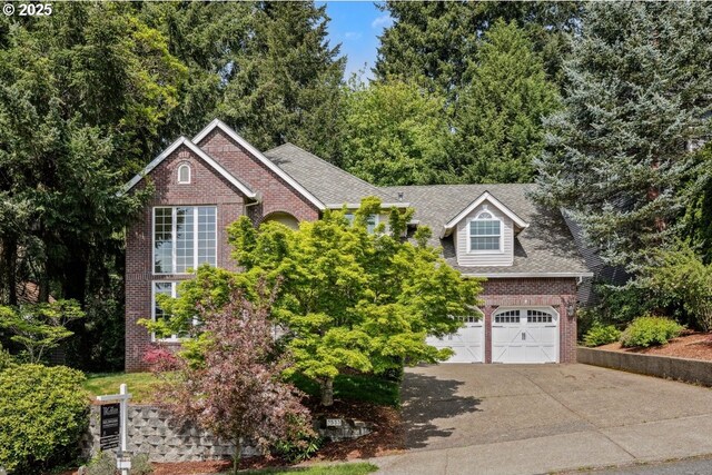 view of front of property with brick siding and driveway