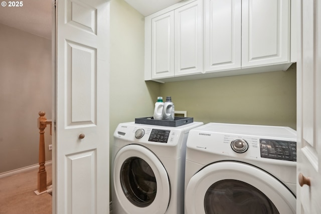 laundry area with washer and clothes dryer, cabinet space, carpet, and baseboards