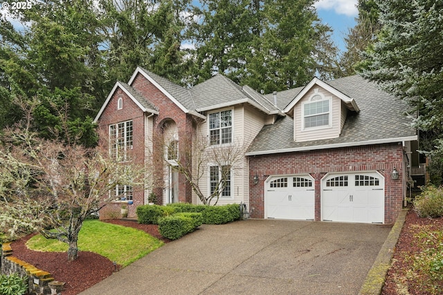 traditional-style house featuring brick siding, driveway, and roof with shingles