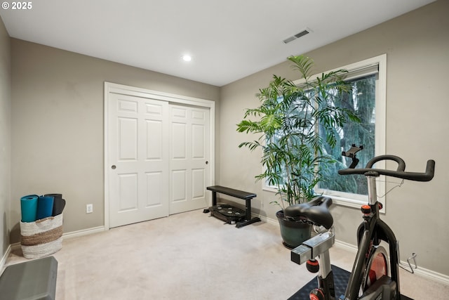 exercise area with carpet, baseboards, recessed lighting, and plenty of natural light