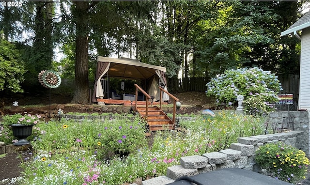 view of yard featuring a gazebo and fence