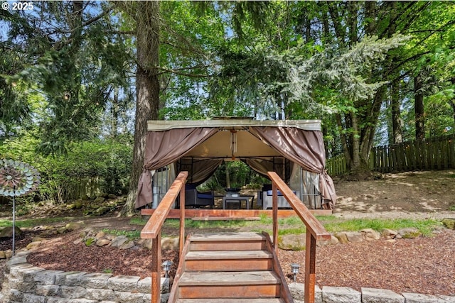 view of yard with a gazebo and fence