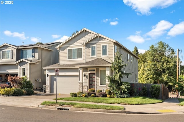 craftsman-style home with solar panels and a garage