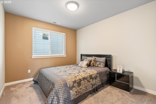 bedroom featuring light carpet