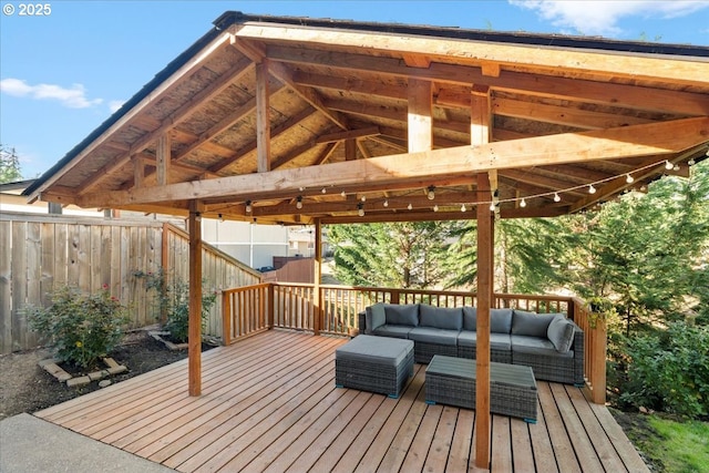 wooden terrace featuring outdoor lounge area