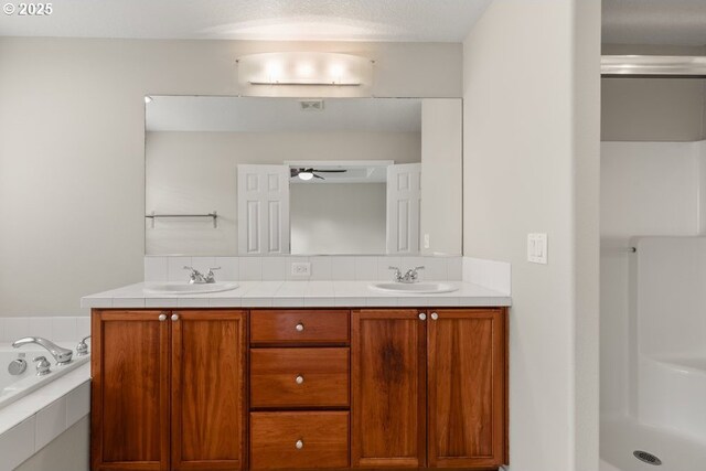 16044 SW Langer Dr, Sherwood, OR 97140 - bathroom featuring double vanity, a bath, a ceiling fan, and a shower