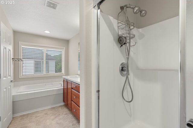 16044 SW Langer Dr, Sherwood, OR 97140 - bathroom featuring a stall shower, a bath, vanity, and tile patterned flooring