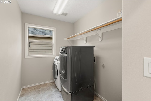 16044 SW Langer Dr, Sherwood, OR 97140 - washroom with washer and dryer and baseboards