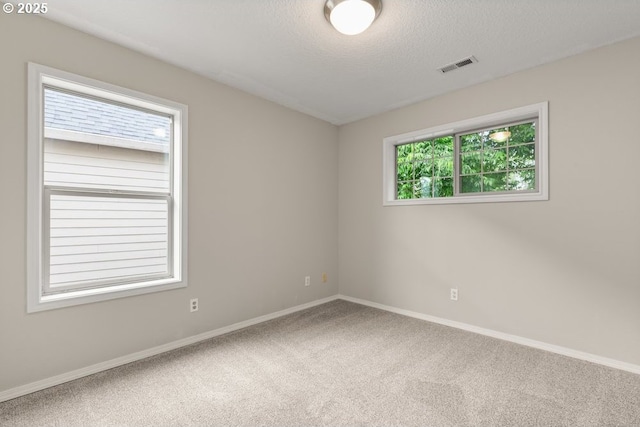 16044 SW Langer Dr, Sherwood, OR 97140 - unfurnished room with carpet floors, baseboards, and a textured ceiling