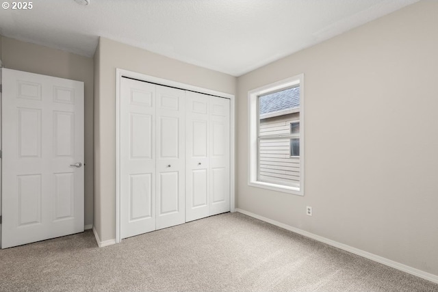 16044 SW Langer Dr, Sherwood, OR 97140 - unfurnished bedroom with carpet floors, baseboards, and a closet