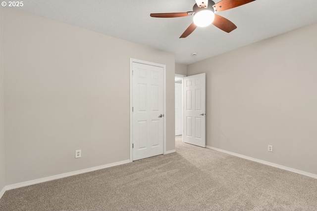 16044 SW Langer Dr, Sherwood, OR 97140 - unfurnished bedroom with carpet, baseboards, and ceiling fan