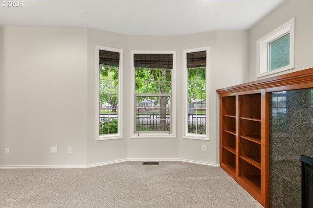 16044 SW Langer Dr, Sherwood, OR 97140 - spare room featuring plenty of natural light, carpet, and baseboards