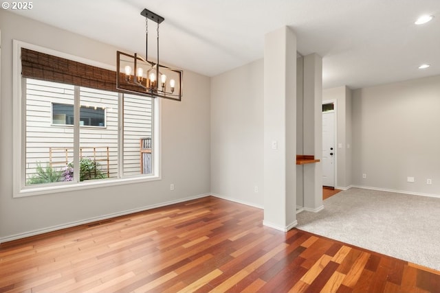 16044 SW Langer Dr, Sherwood, OR 97140 - empty room featuring wood finished floors, a chandelier, baseboards, and recessed lighting
